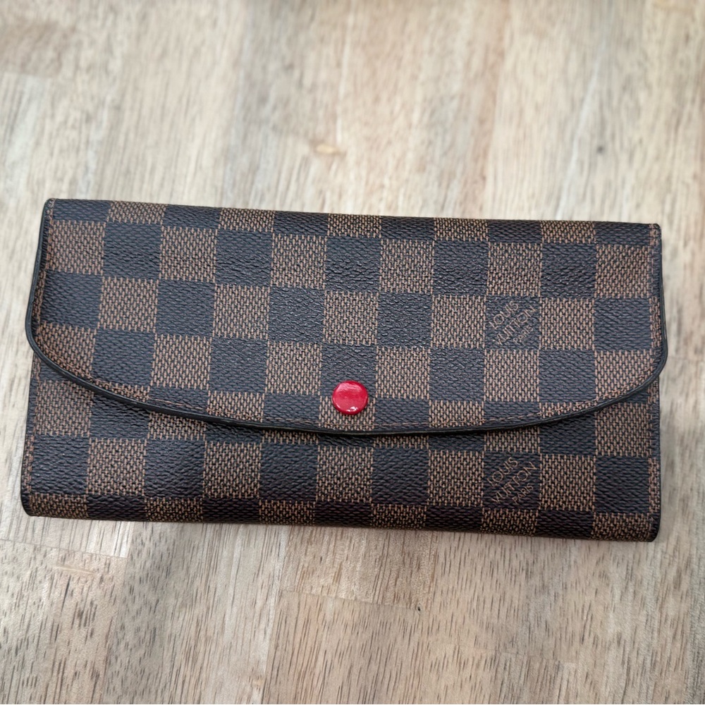 Authentic Louis Vuitton Emilie Wallet w/Cherry red details.